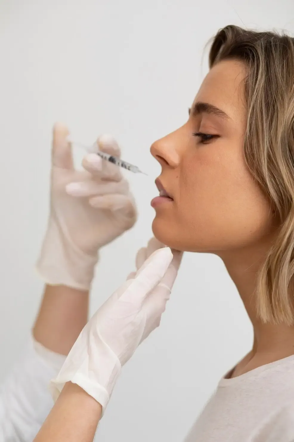 Aplicação de toxina botulínica em perfil